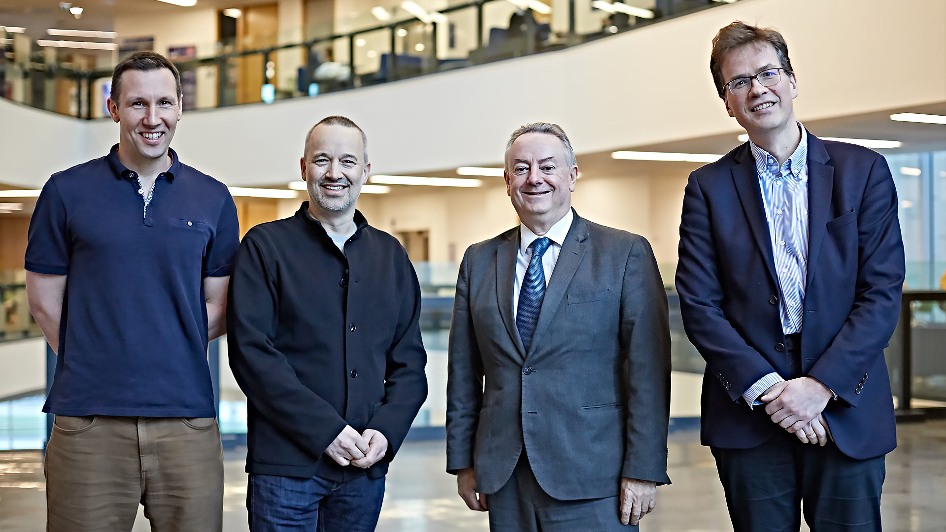 John Warhurst (centre left) and the University's Vice Chancellor Professor Bob Cryan (centre right) with Stewart Worthy (far left) and Thomas Schmidt (far right)