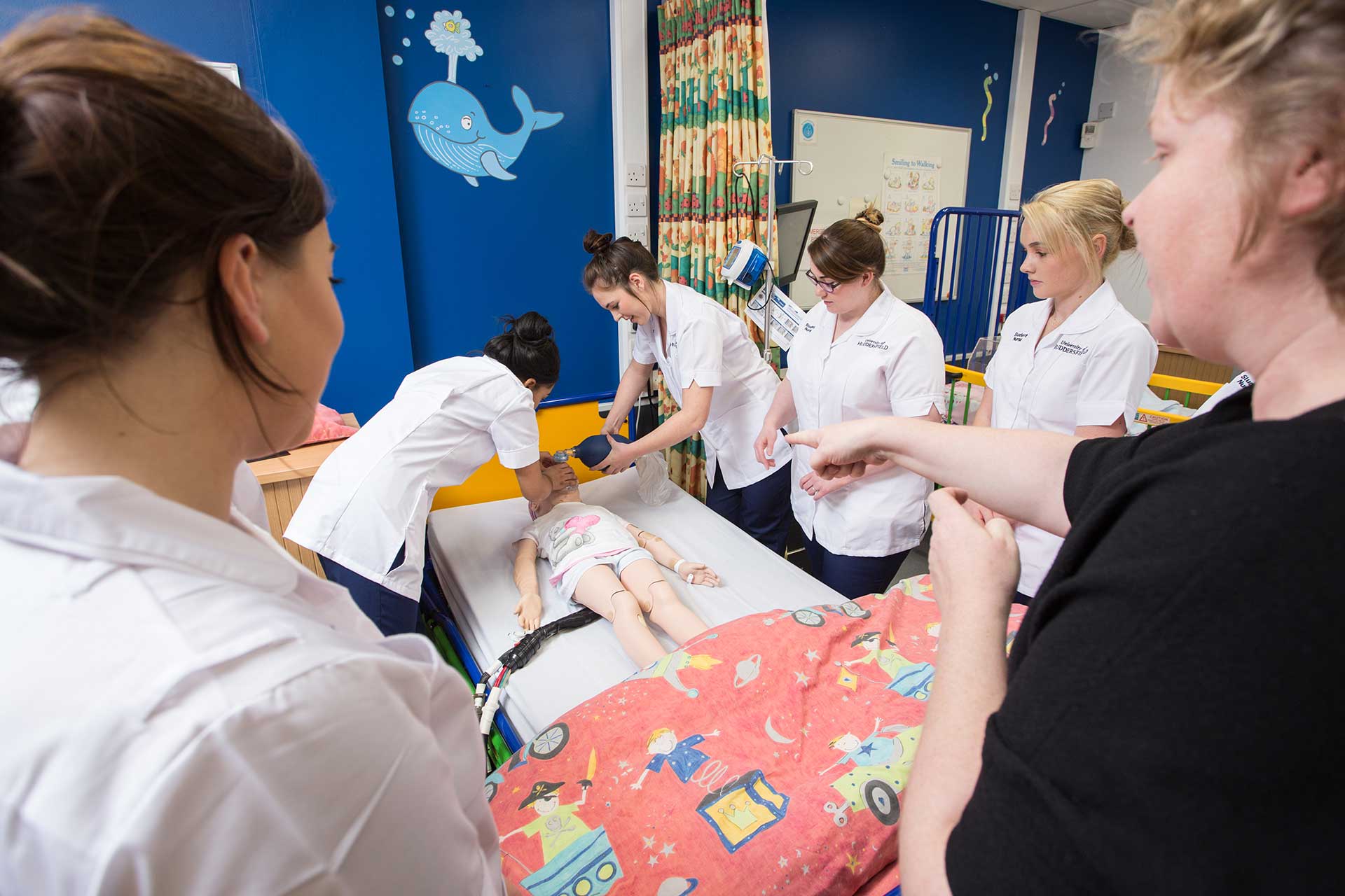 Simulated childrens ward, with students in clinical session
