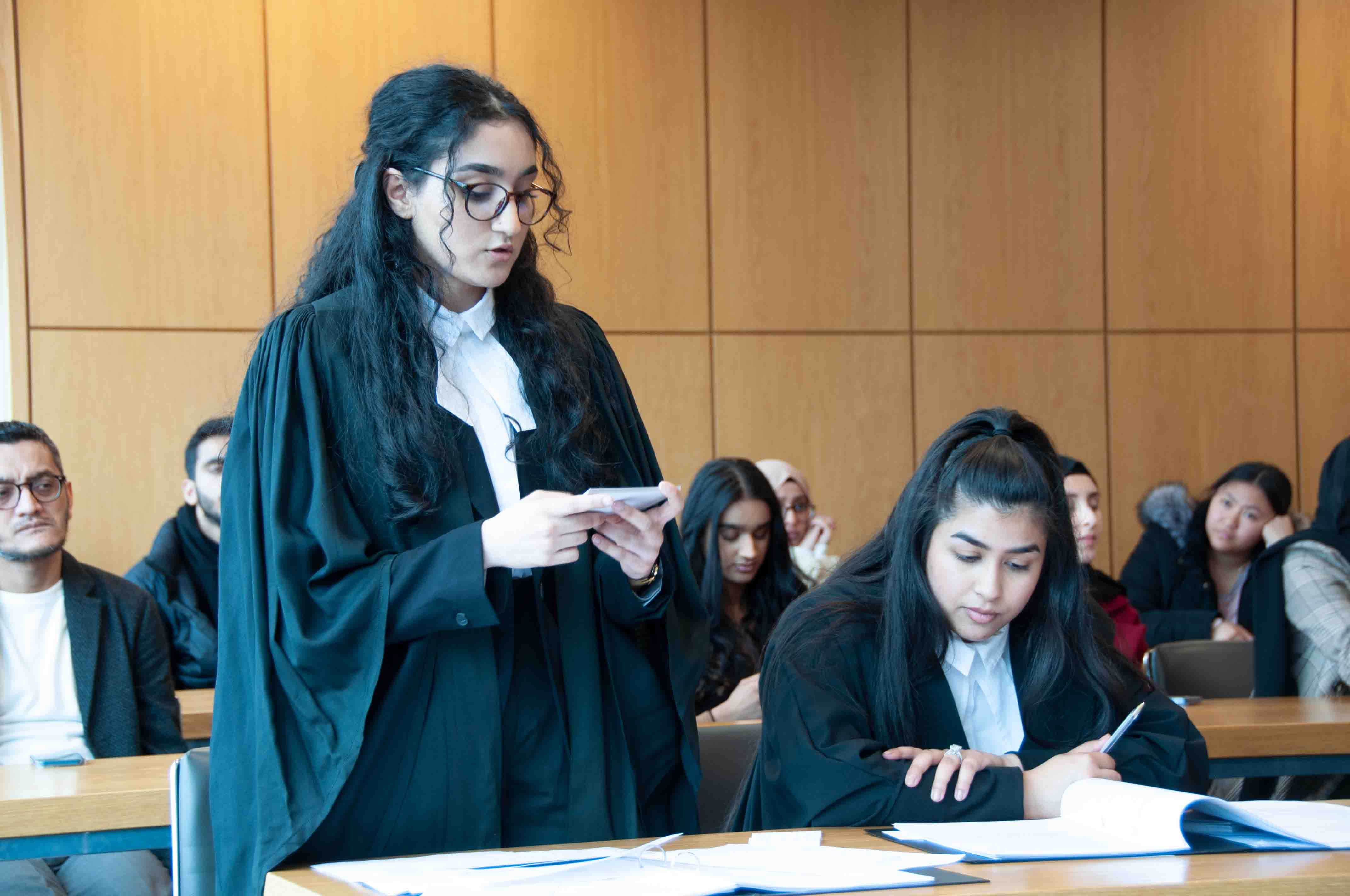 A law student presenting an argument in a courtroom