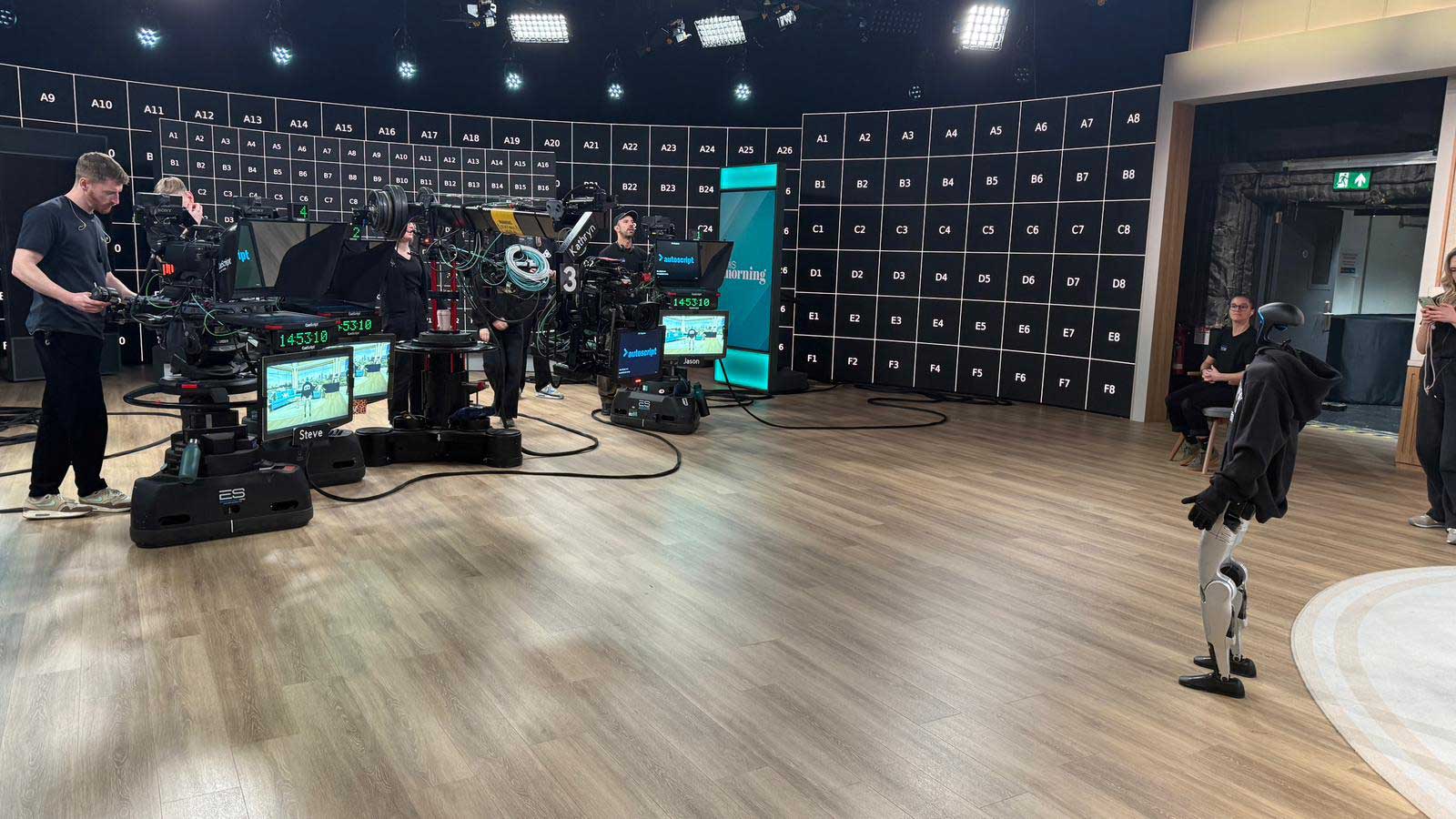 Harold the Robot is behind the scenes at This Morning. Harold on one side looking at a number of cameras on the other side.