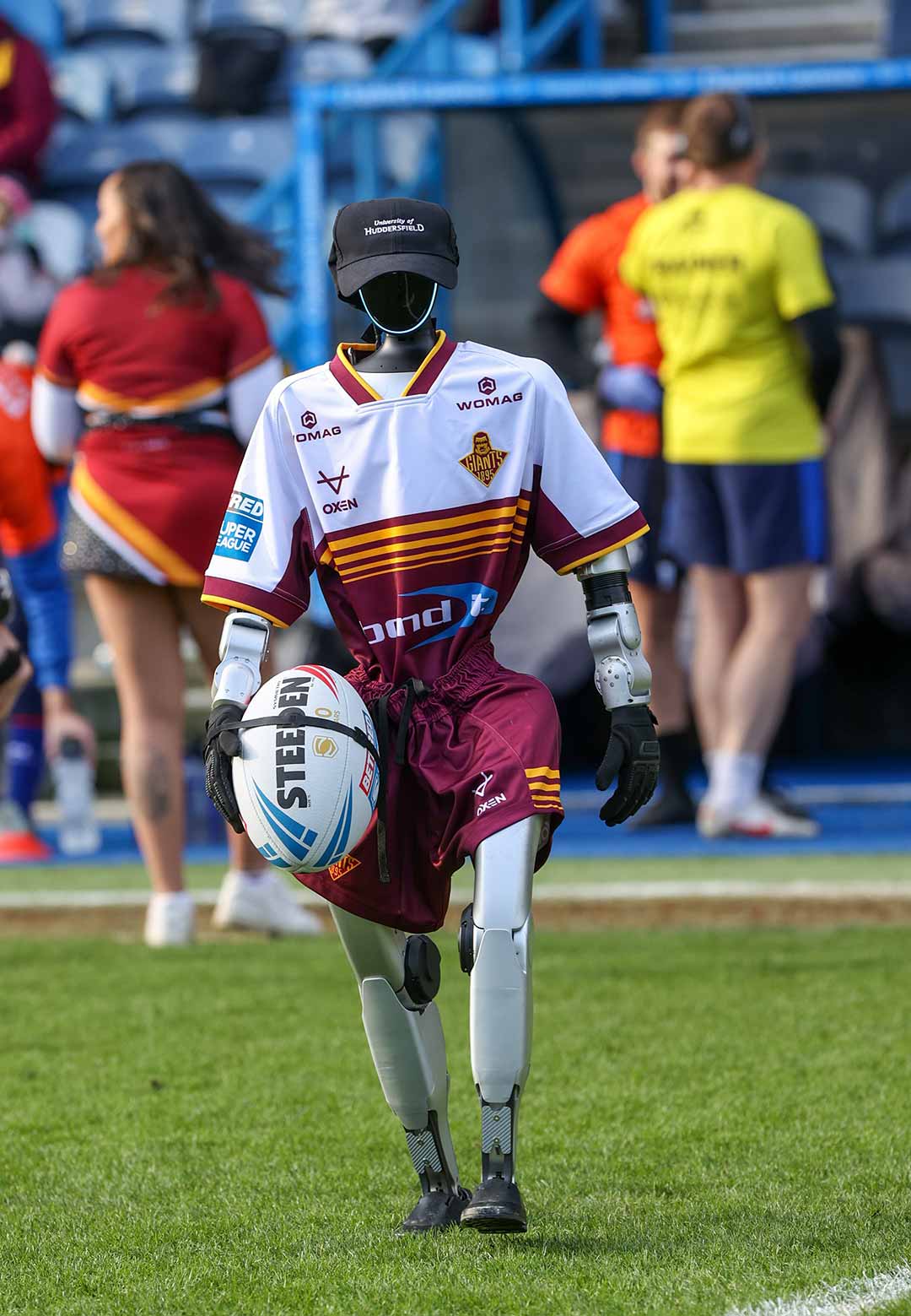 Harold the Robot carries the matchball at the Huddersfield Giants first home game of the season