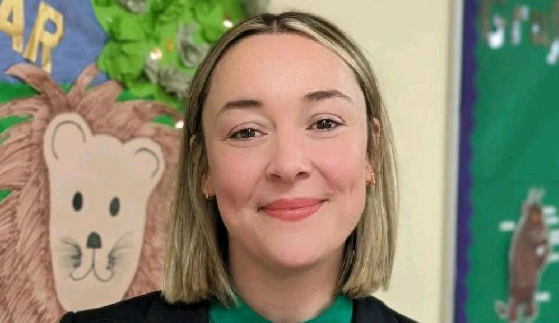 Headshot of Carly Woodhead in a classroom