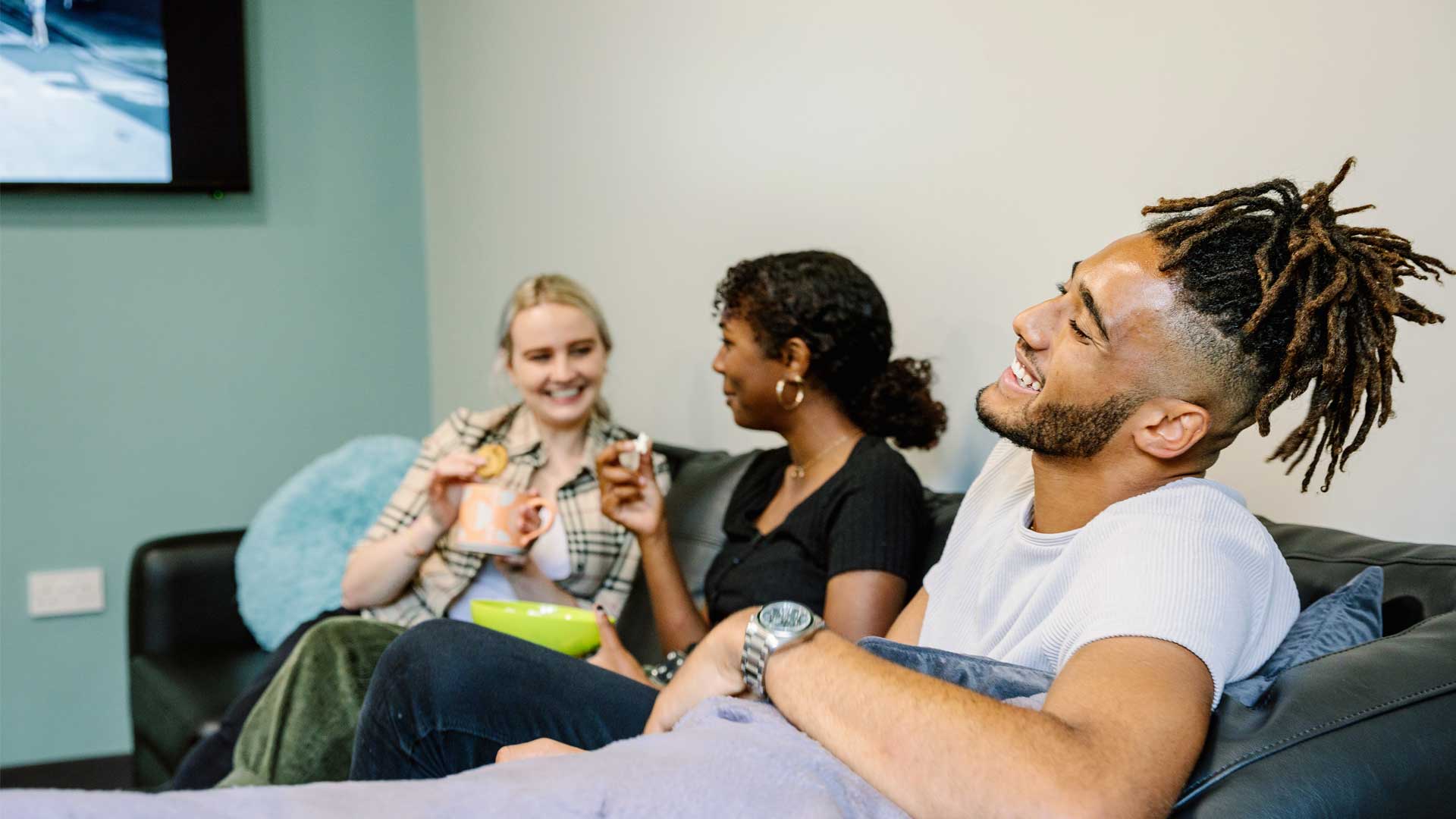 Students relaxing in a lounge at Storthes Hall