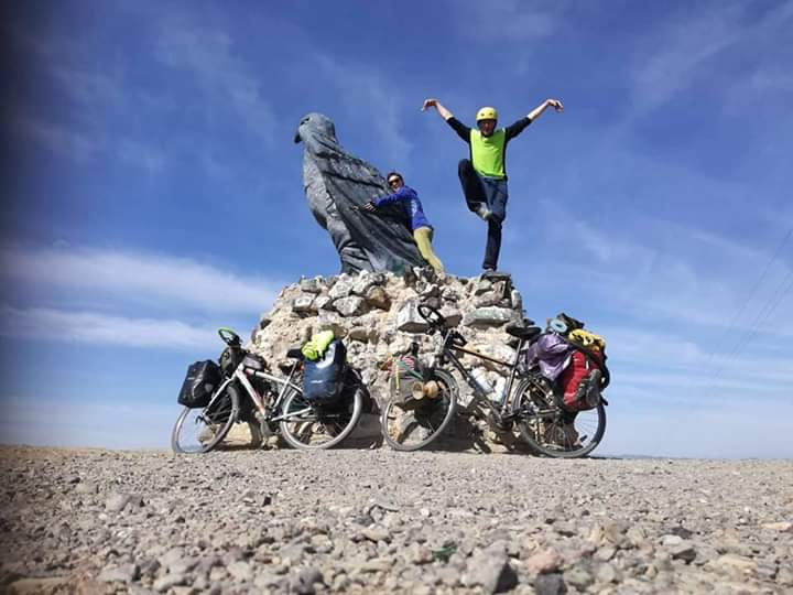 David Steedman posing on a rock with his bike