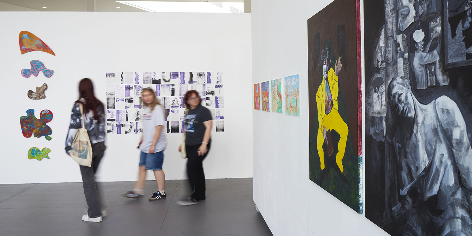Three visitors tour the Art Showcase in Barbara Hepworth