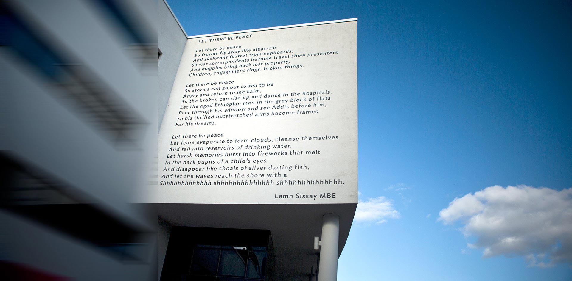 Creative Arts Building with Lemn Sissay's poem depicted on its side.
