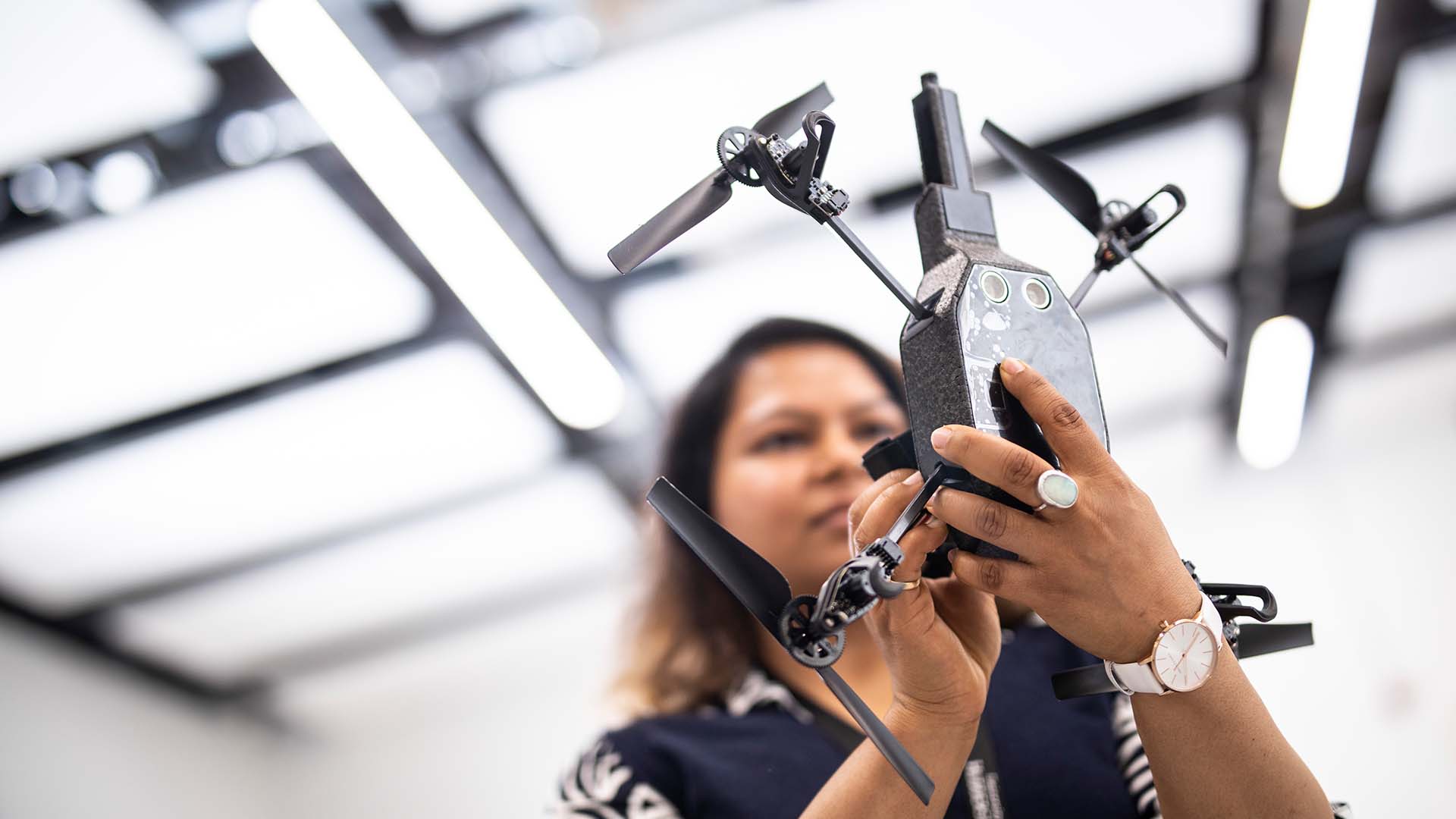 Student working on a drone
