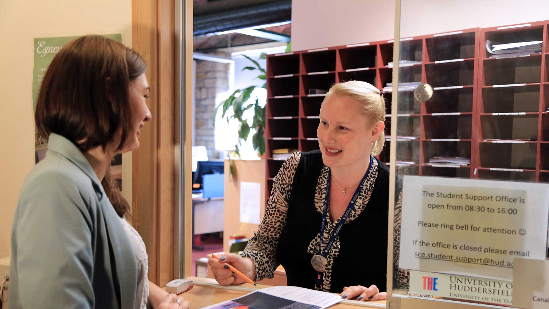 Student at the Student Support Office hatch