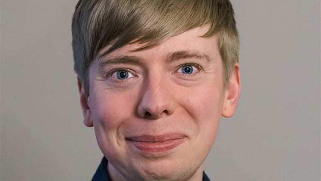 Tom Simcock smiling at the camera