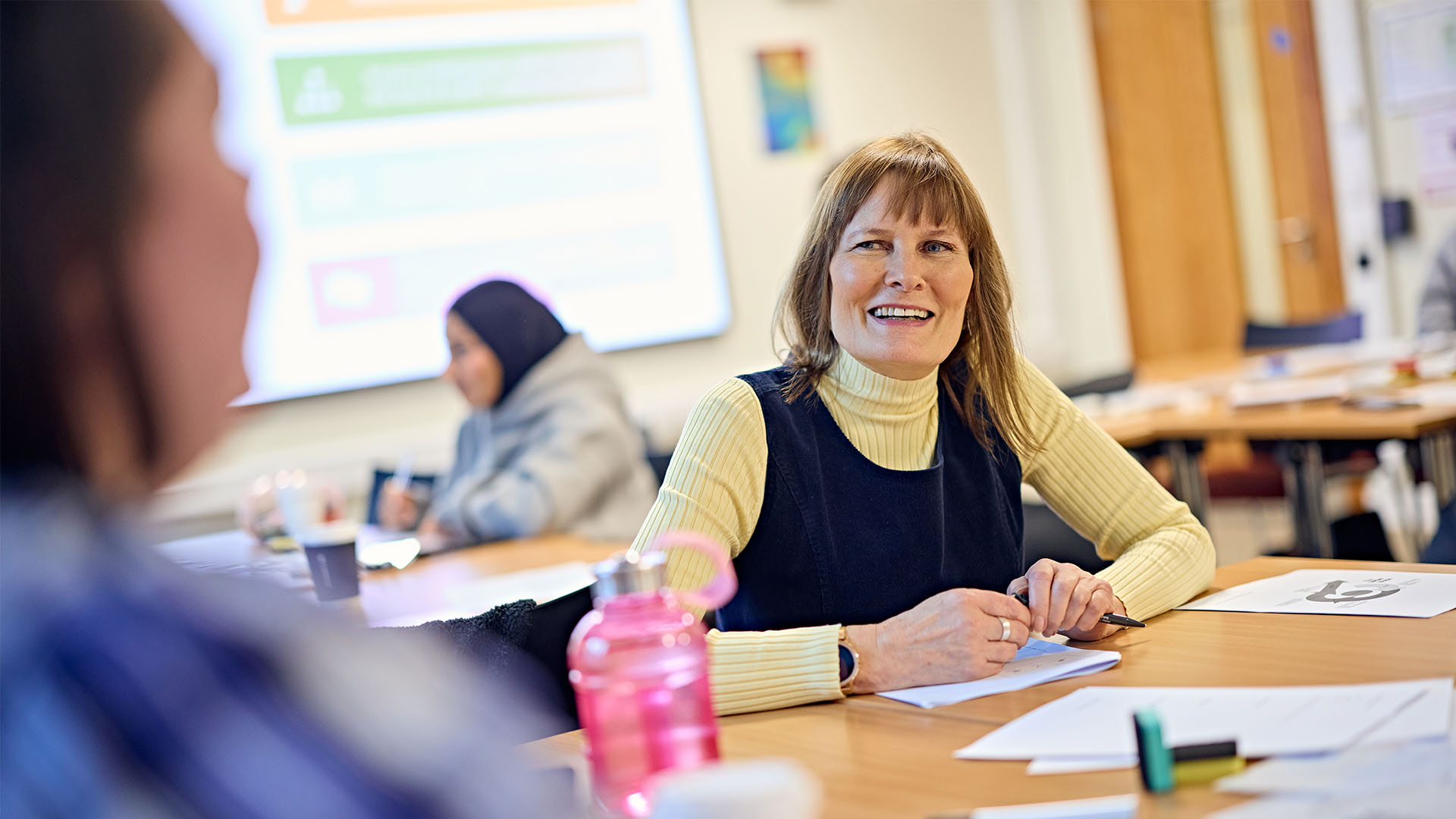 Teacher smiling in classroom
