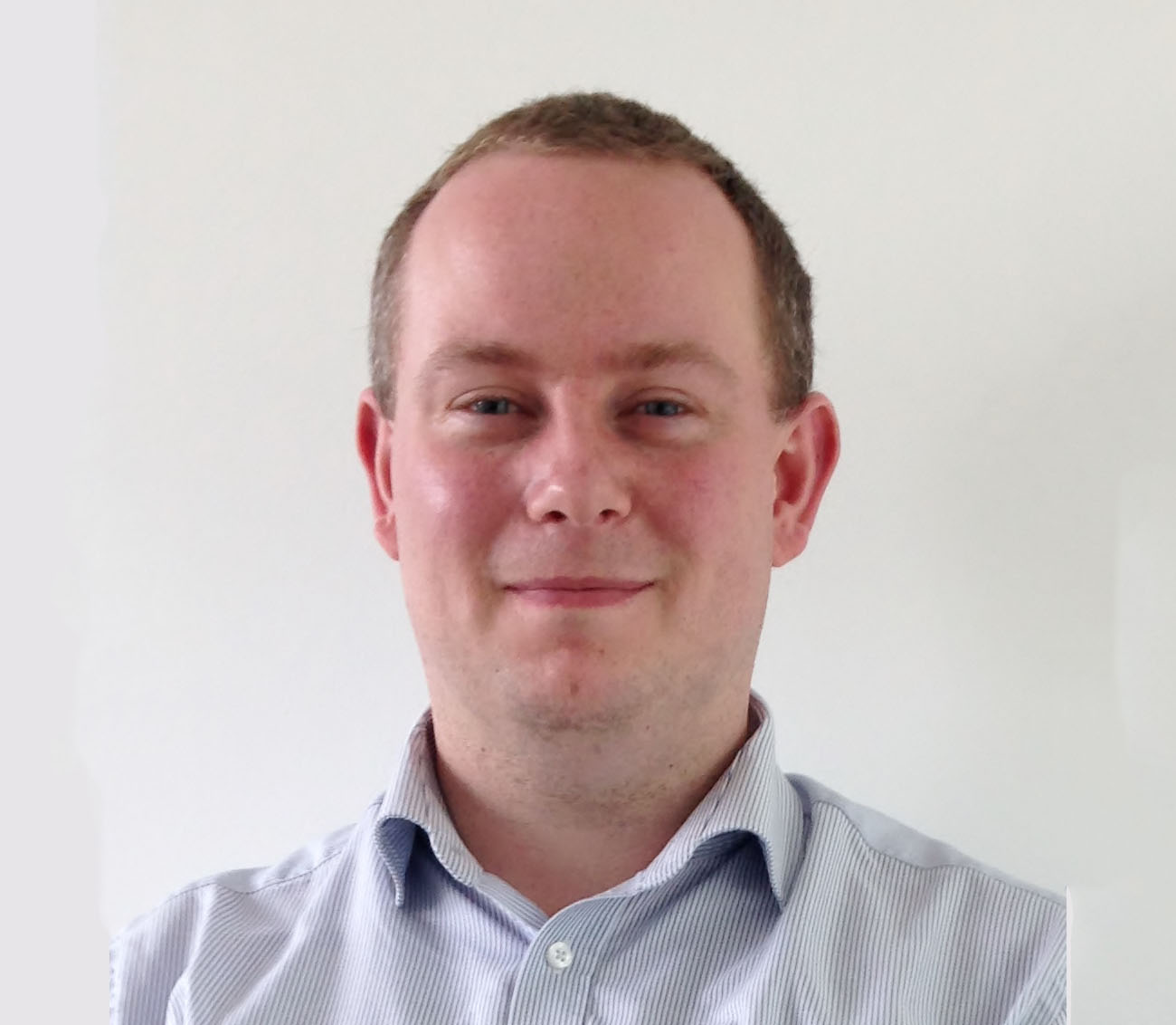 photo of Dr Keith Couper, who is wearing a striped shirt.