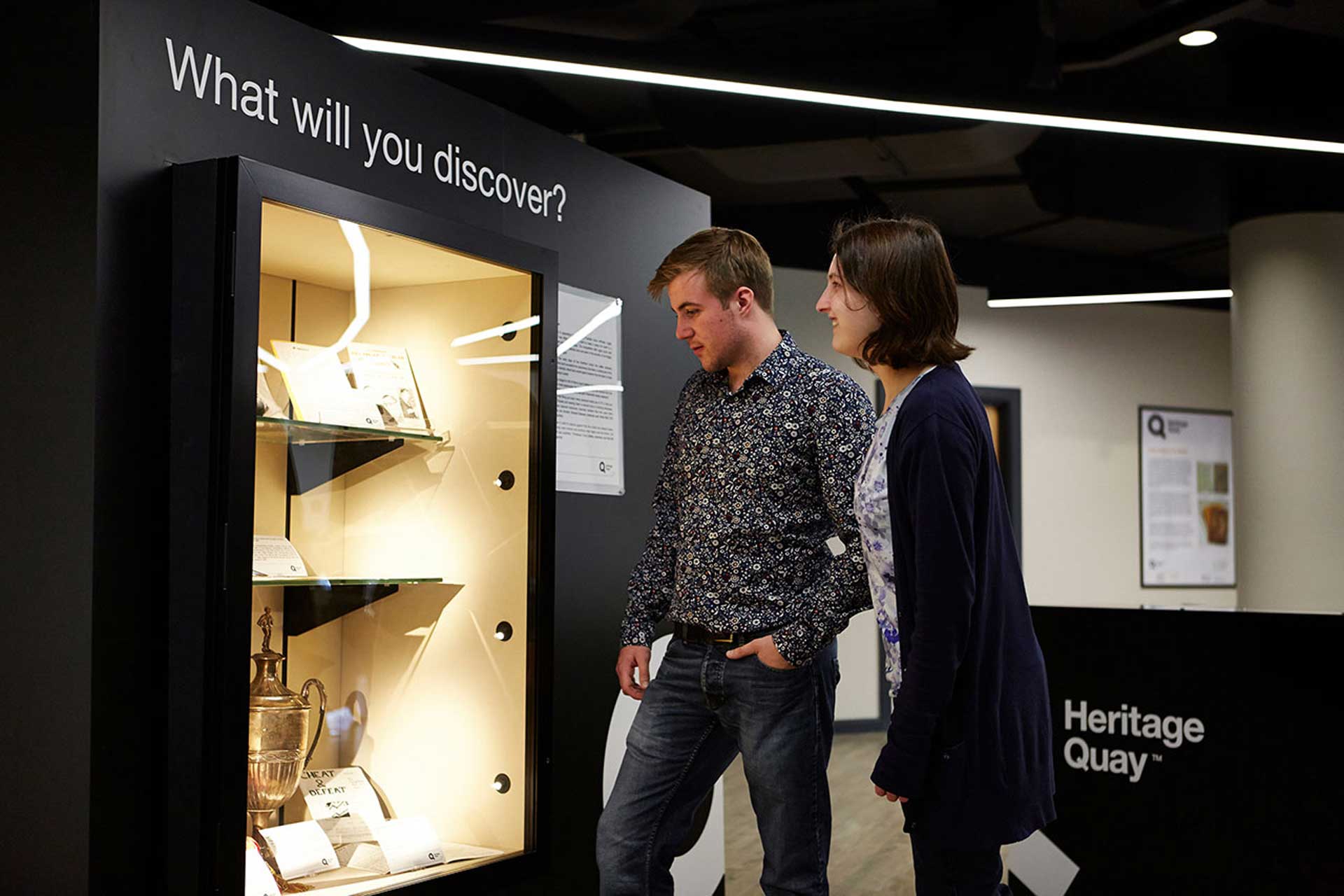 A history student looking at a museum collection