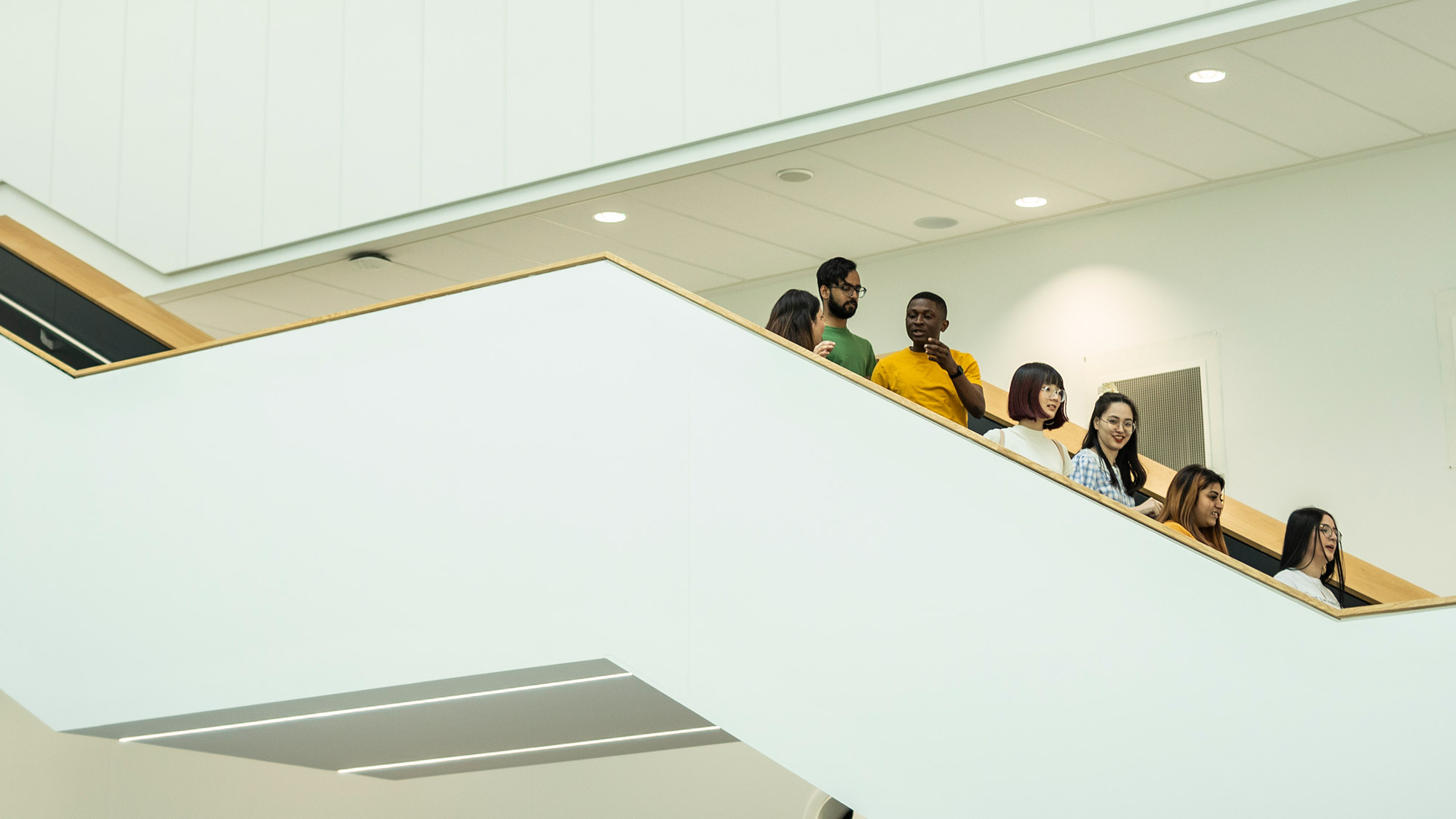 Students walk down the stairs in the Barbara Hepworth Building 