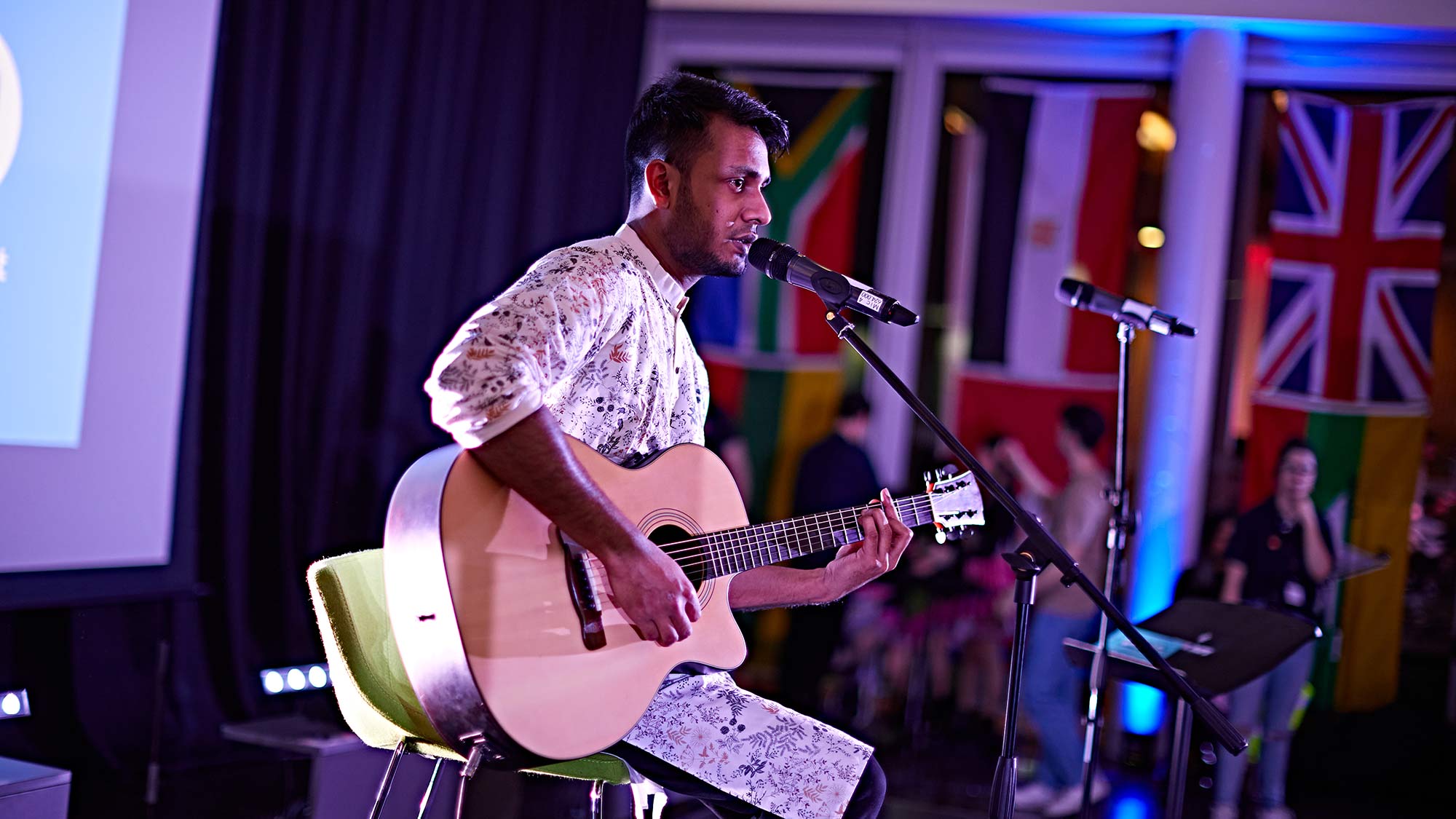 A student performs on stage at the Global food and culture festival. . 