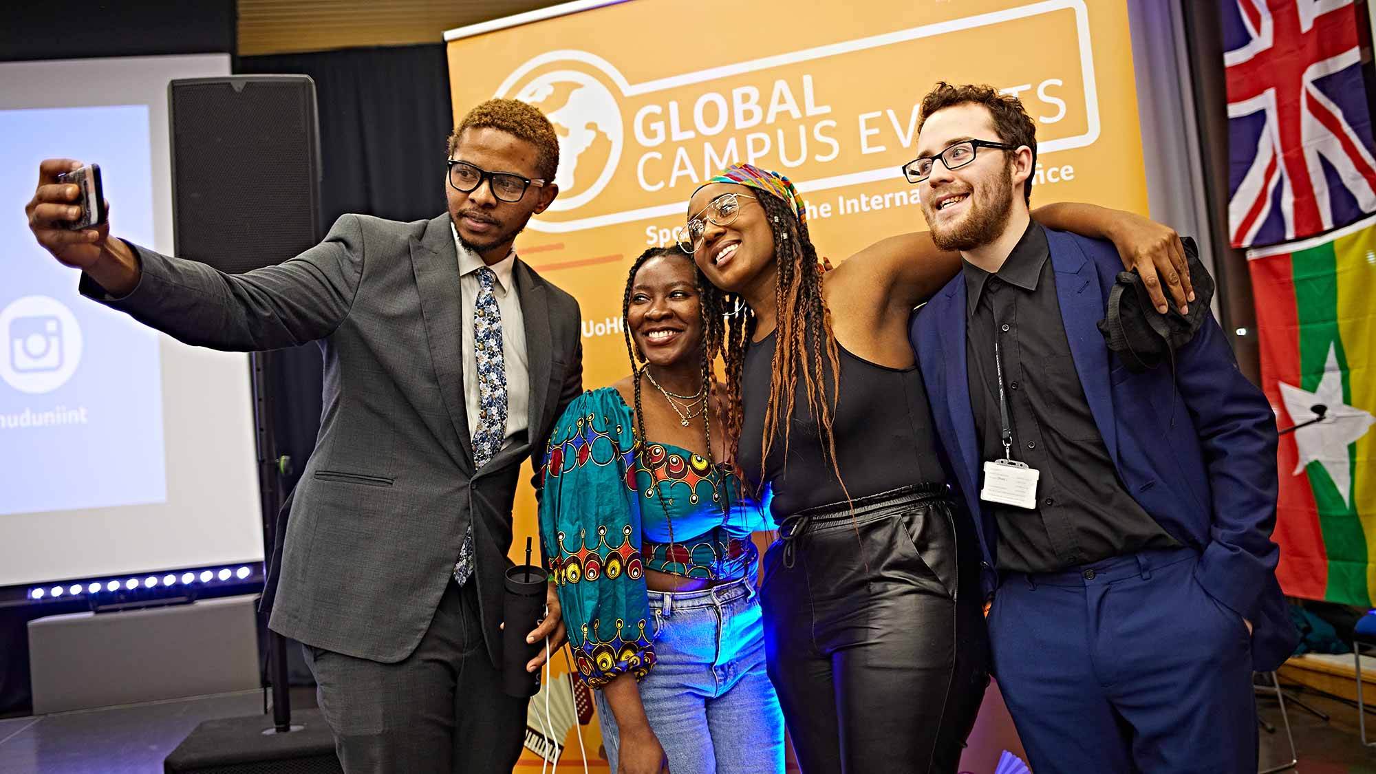 A group of students take a selfie together at the Global Food and Culture Festival. 