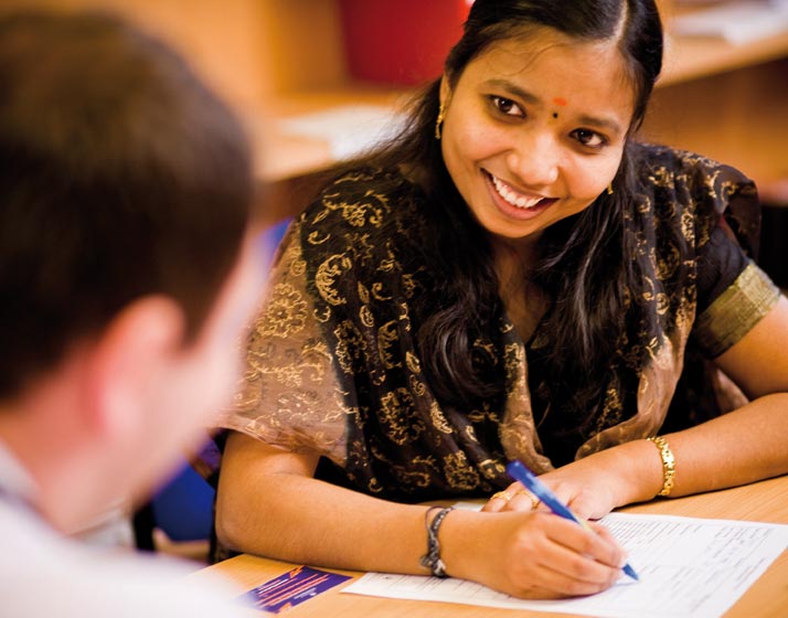 Picture of an international student filling out a form