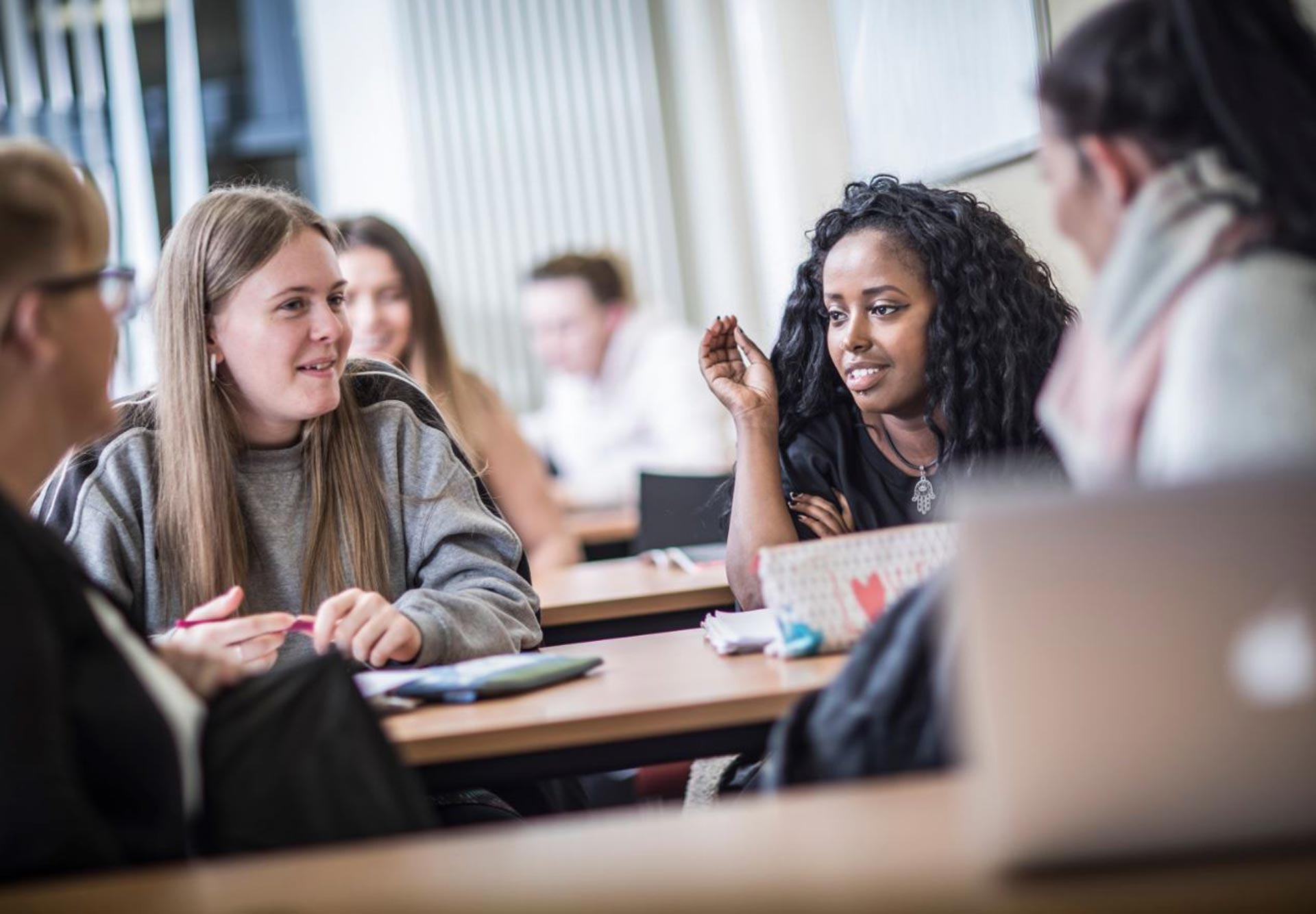 Students talking in a classroom