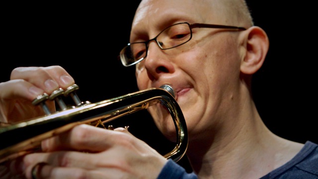 Close-Up Steve Altoft playing a brass instrument