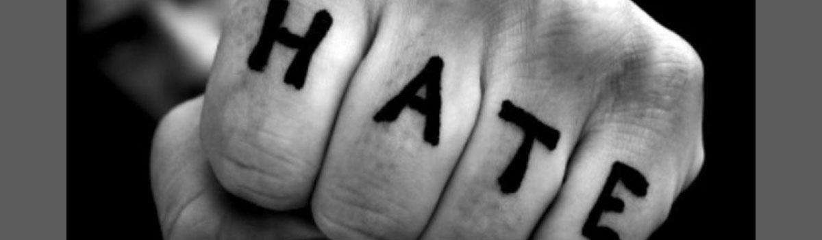 HATE written on fist