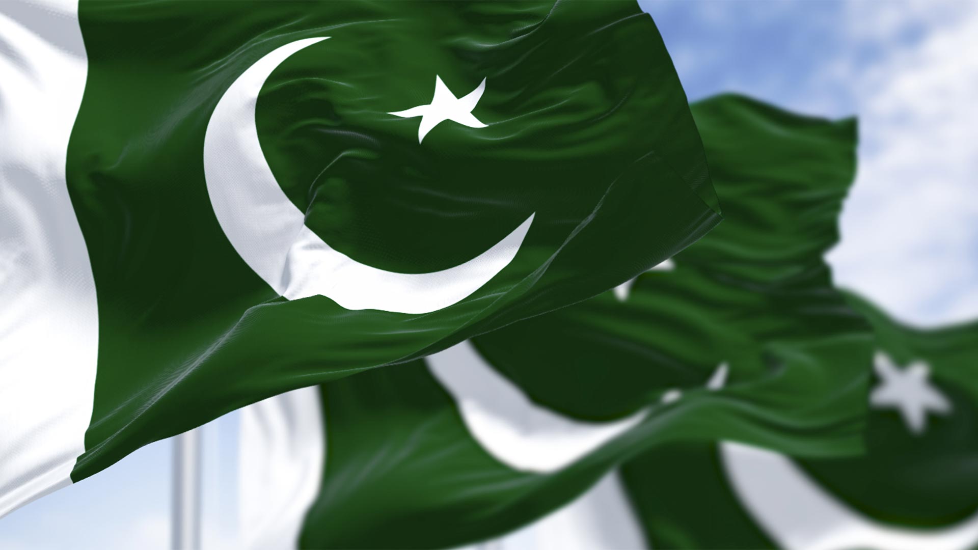 Pakistan flags against the sky