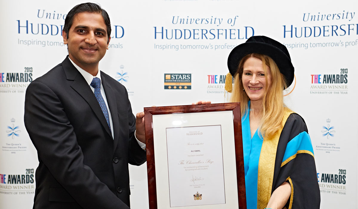 High performing student Ali Iqbal receiving his Chancellor's Prize