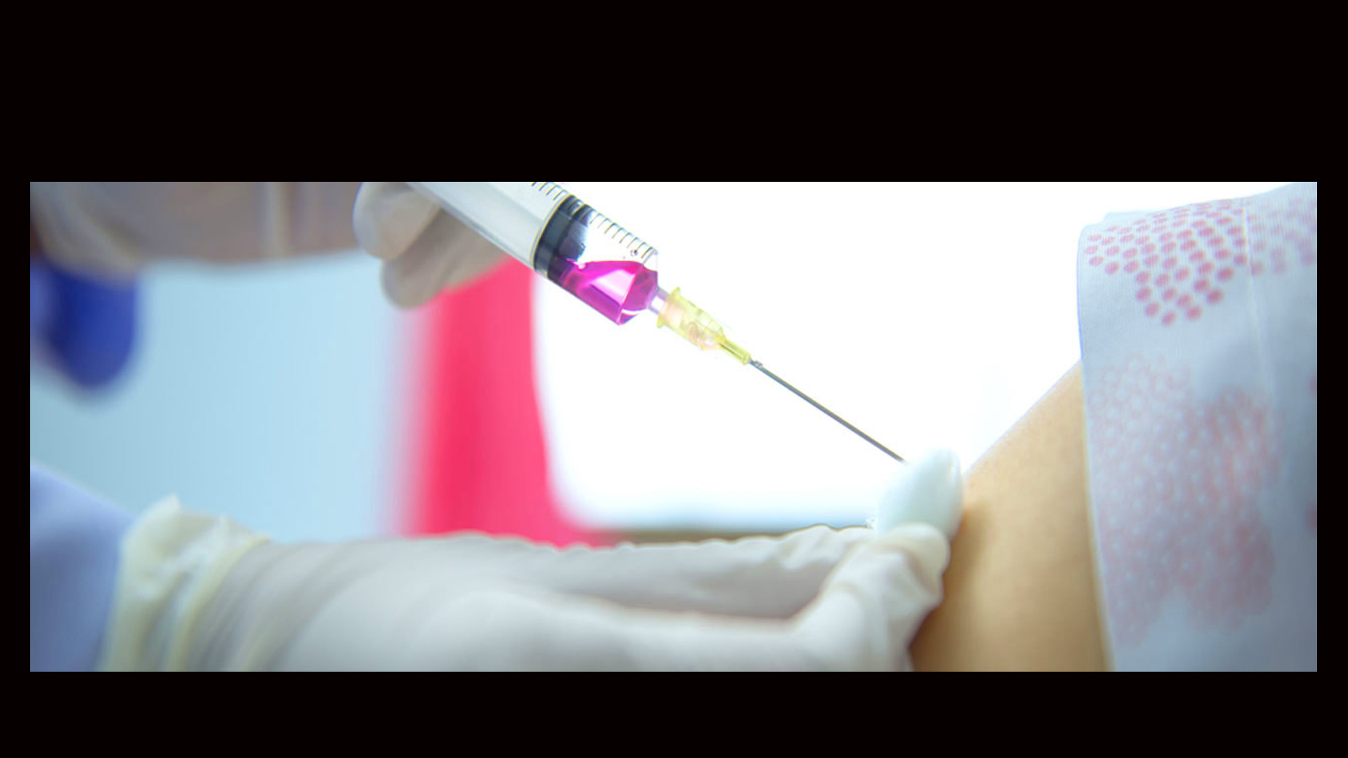 A syringe being administered