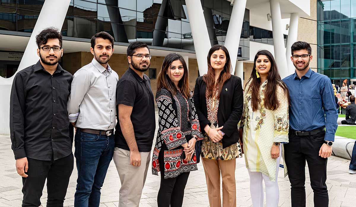Pictured with members of the University's Pakistani Student Society is Community Welfare Attaché Mrs Fizzah Niazi, third right