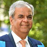 Ashok Vaswani, CEO of Barclays UK, receiving his honorary award