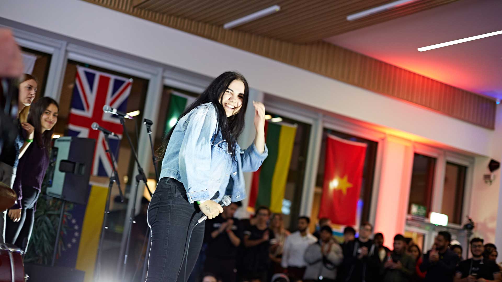 international student on stage at the global food and culture festival