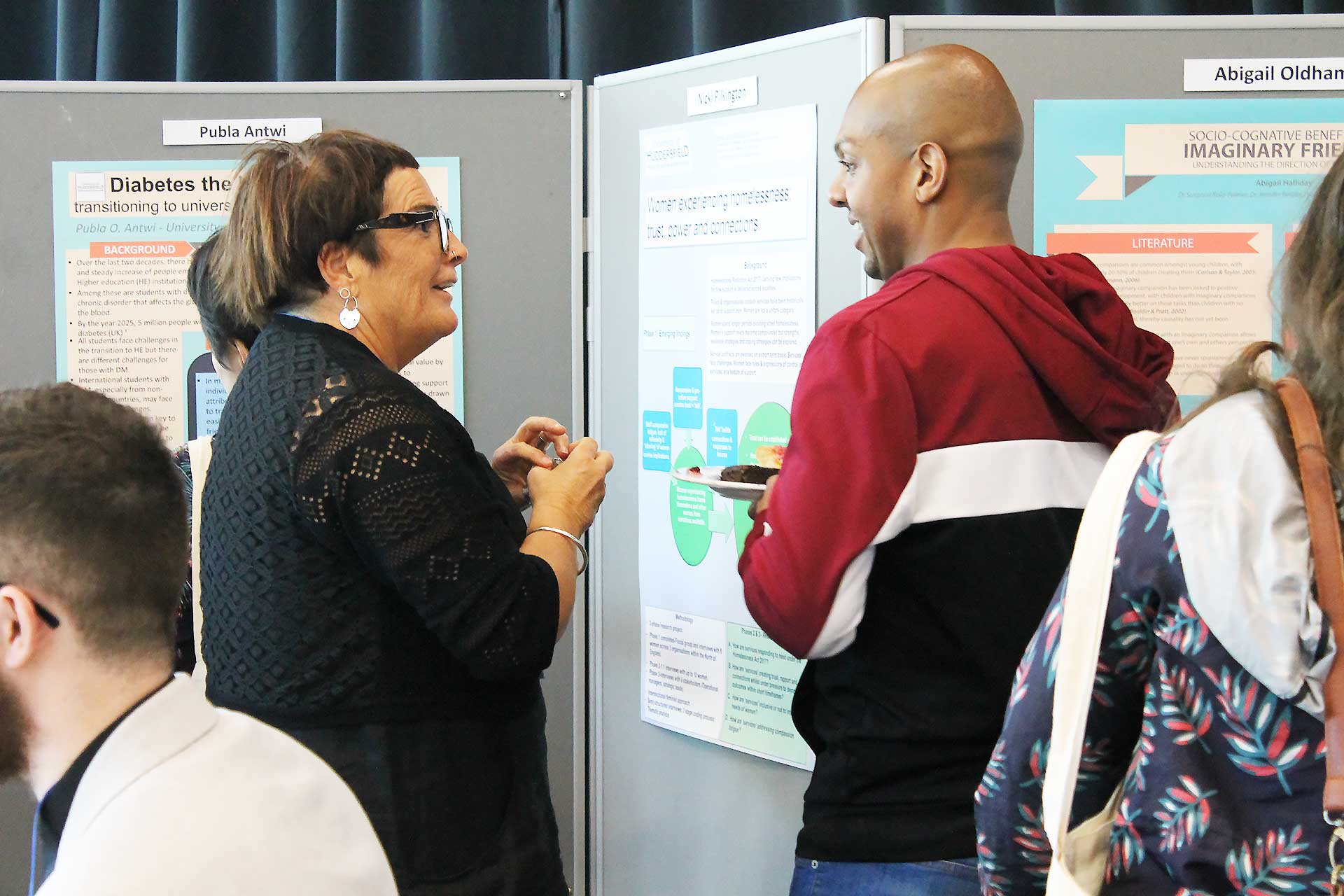 Researchers talking at the Engage Research Conference