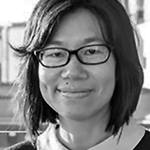 Dr Hui-Yun-Chan smiling in a black and white photo
