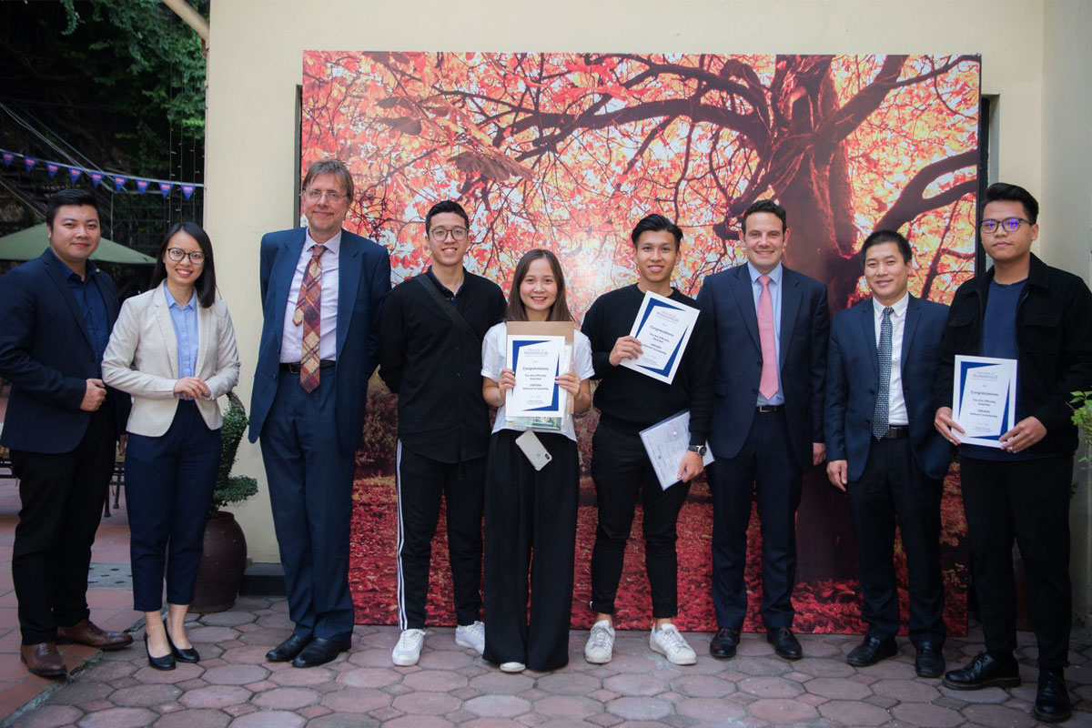 The University’s Professor John Anchor (third left) and Director of International Development Andrew Mandebura (third right) with some of the Vietnamese students receiving scholarships. 