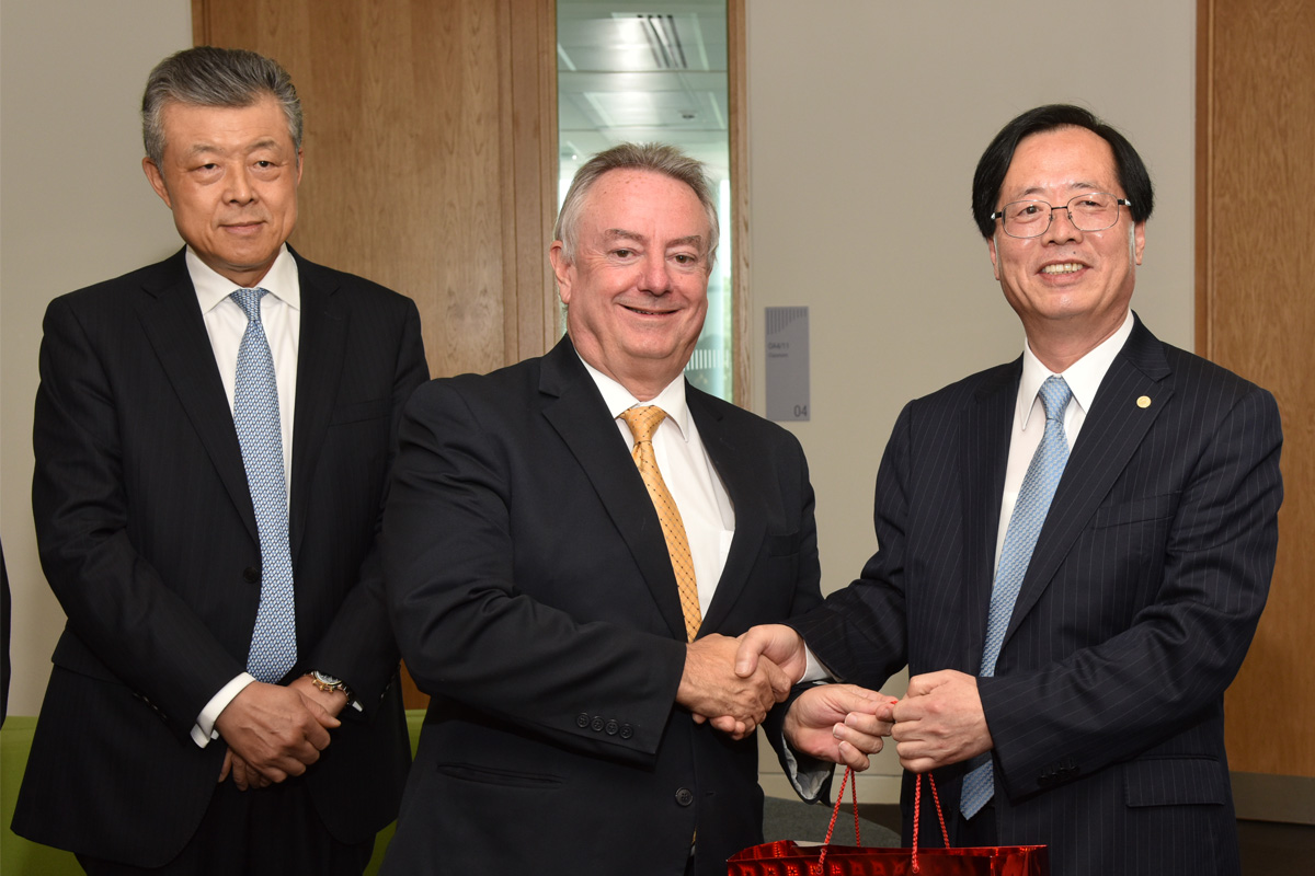 The University's Vice-Chancellor, Professor Bob Cryan (centre), and the President of ECUST, Professor Qu Jingping (right), at the signing ceremony with the Chinese Ambassador to the UK, His Excellency Liu Xiaoming (left).