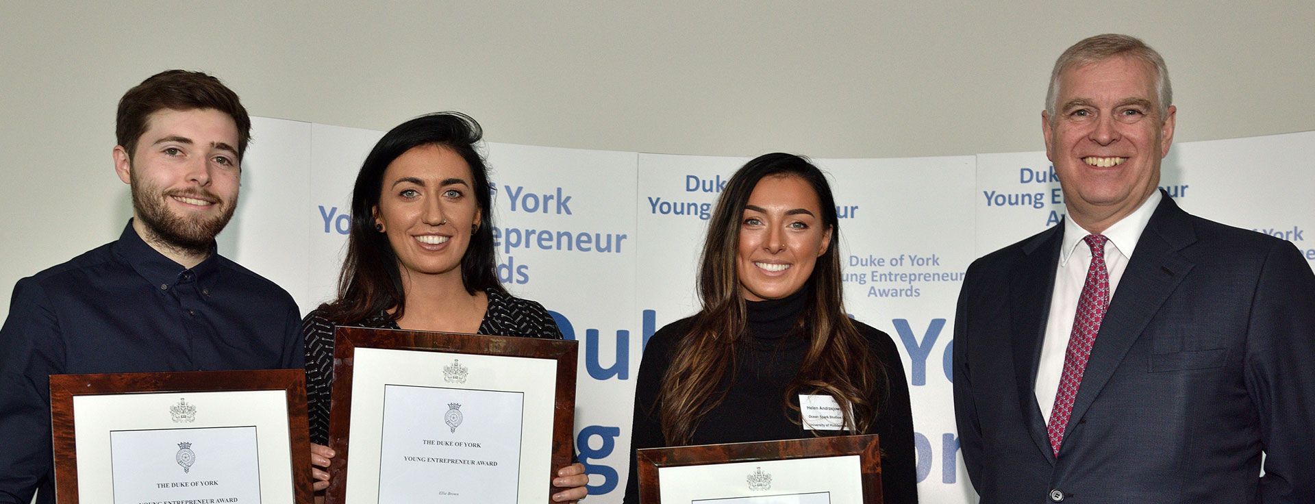 Huddersfield’s winners (l-r) Zachray Cundall, Ellie Brown and Helen Andrzejowska, who comprise Ocean Spark Studios, receiving their certificates from the University's Chancellor, HRH The Duke of York