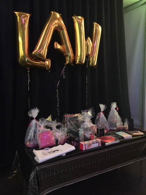 Table with awards under law balloons for the Law School Challenge