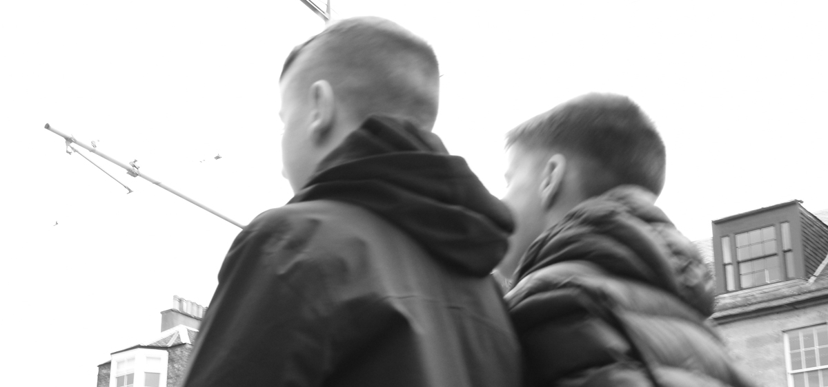 image of youths from behind