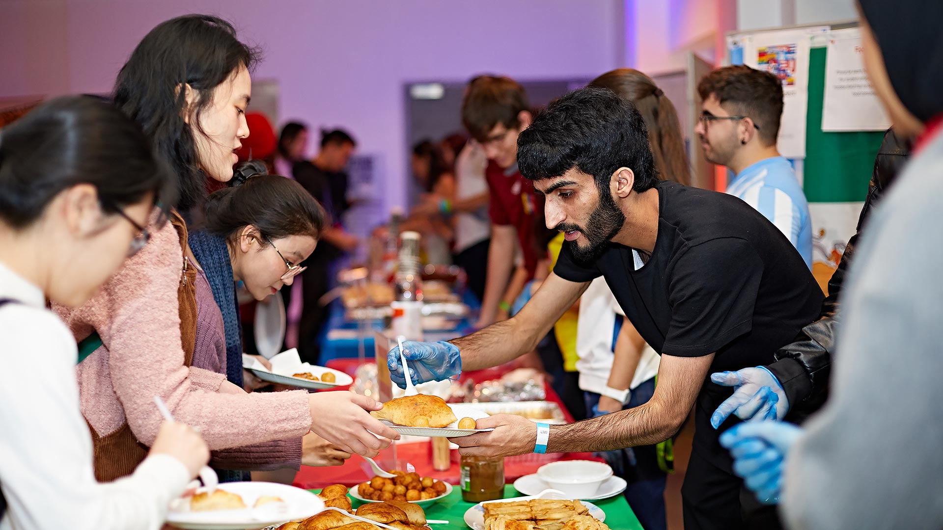 Students enjoying the food at the 10th global food and culture festival