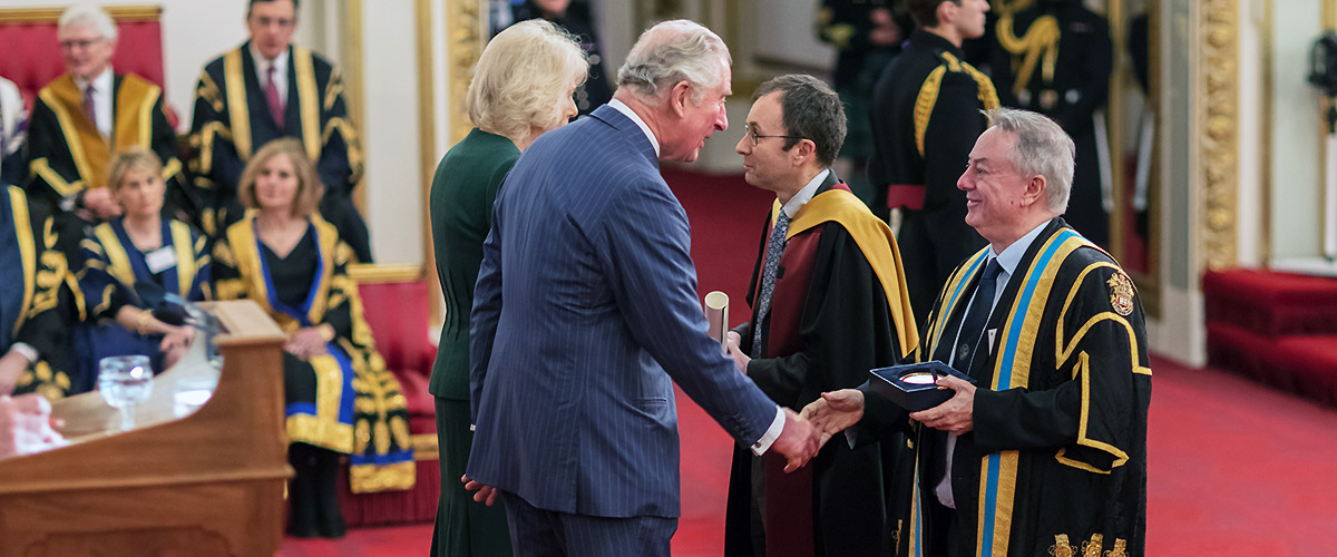 Simon Iwnicki and Bob Cryan receive the Queen's Anniversary Prize at Buckingham Palace