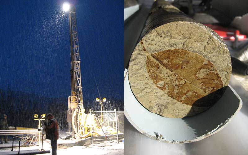 A drill rig at night with a person standing in front of it, with rain visible in the flood lights and a fossilised leaf in a rock sample