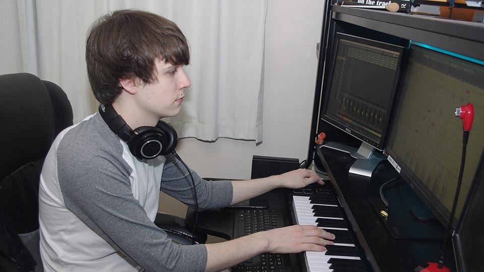 Alex Smith with a keyboard playing music