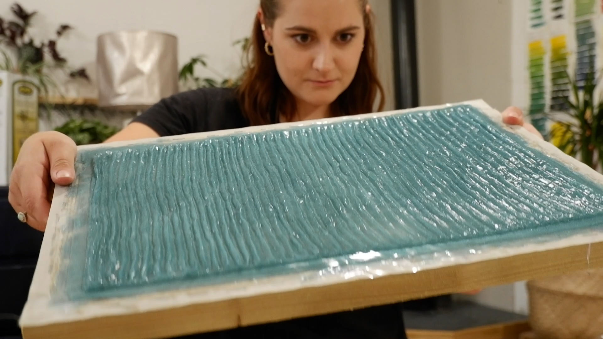 Student Anna Watkins at work making seaweed leather in a mould