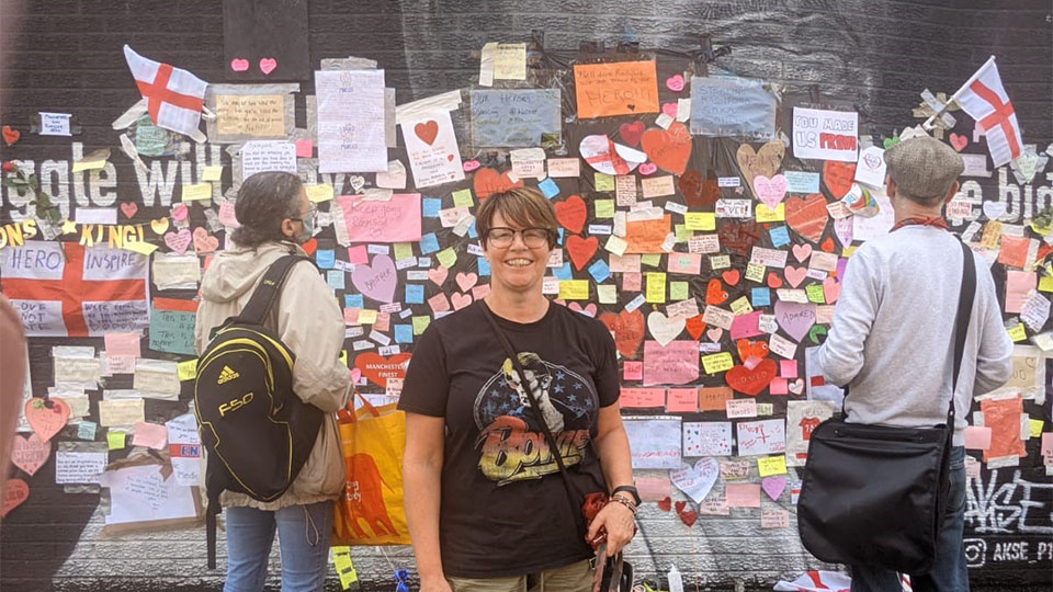 Helen Connor in front of the Marcus Rashford mural