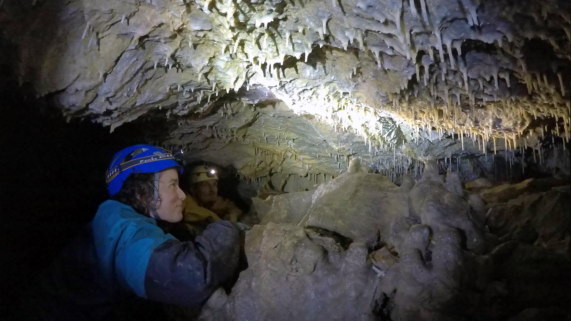 Dr Bethany Fox conducting research in a cave in New Zealand