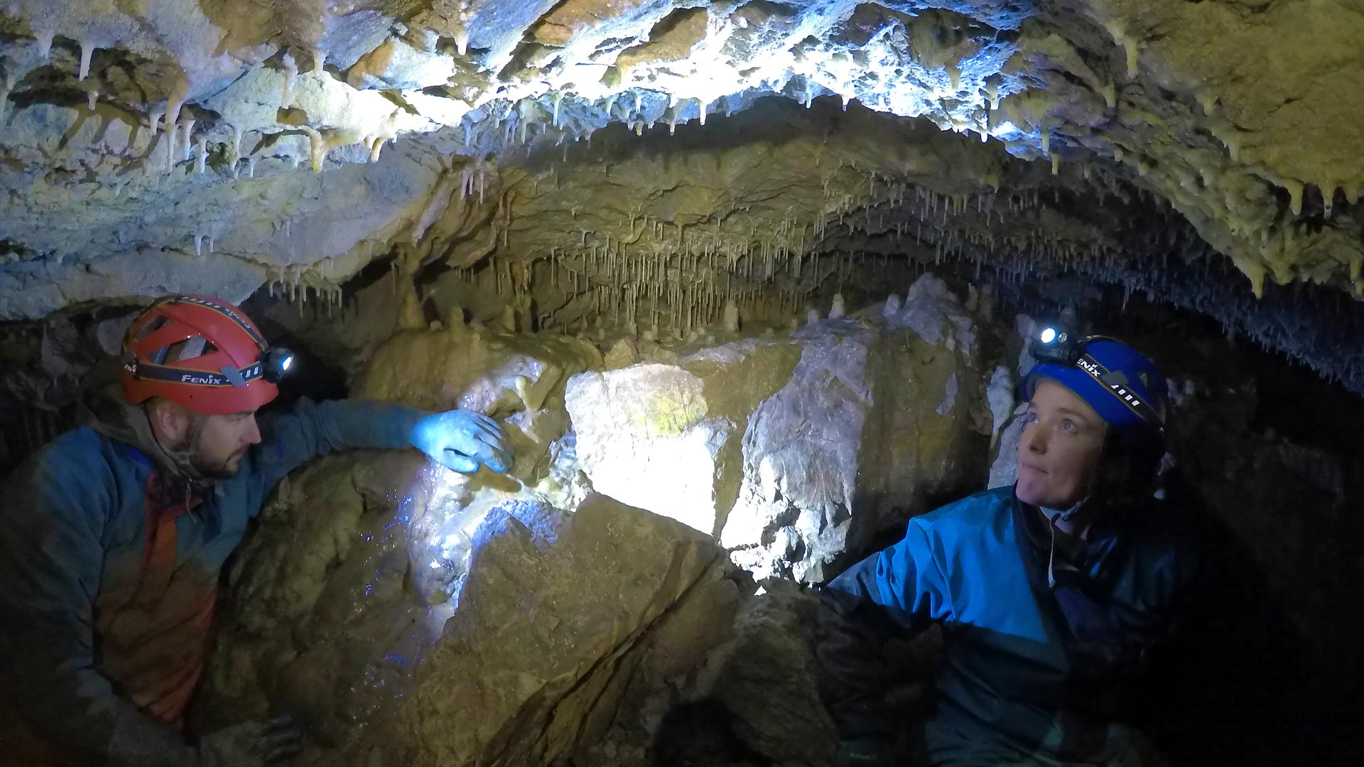 Dr Bethany Fox conducting research with Matthias Magiera in a cave in New Zealand