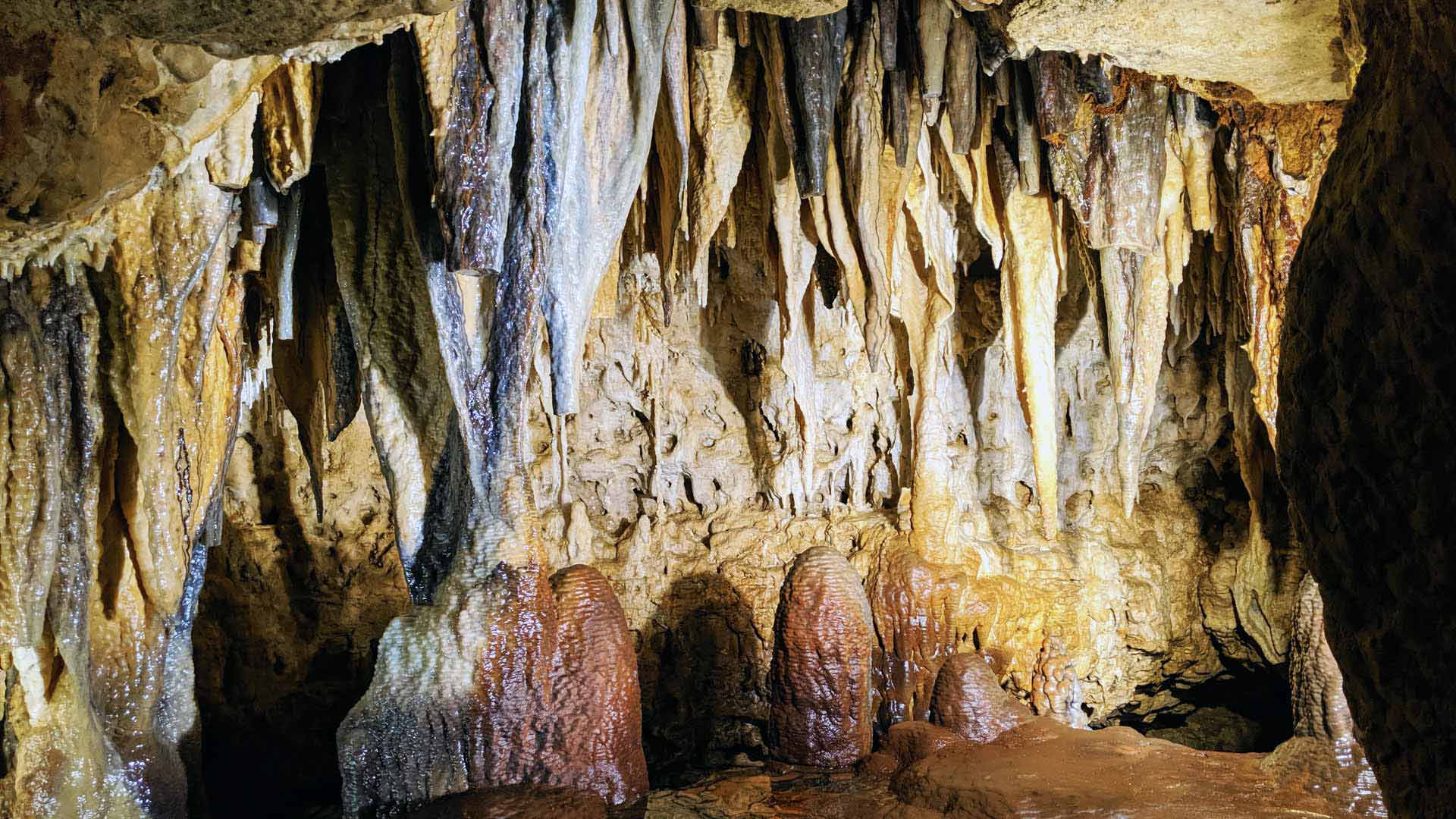 A cave with stalactites and stalagmites formations