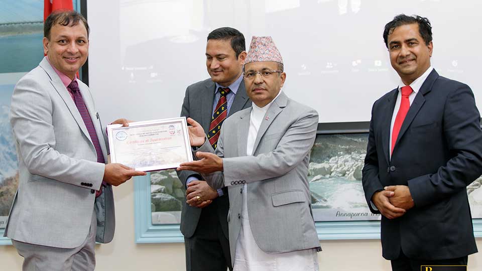 Professor Padam Simkhada with Lokdarshan Regmi, Nepal's Ambassador to the UK