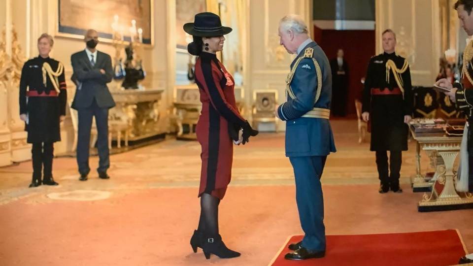 Adele Jones speaking to Prince Charles in a room at Windsor Castle