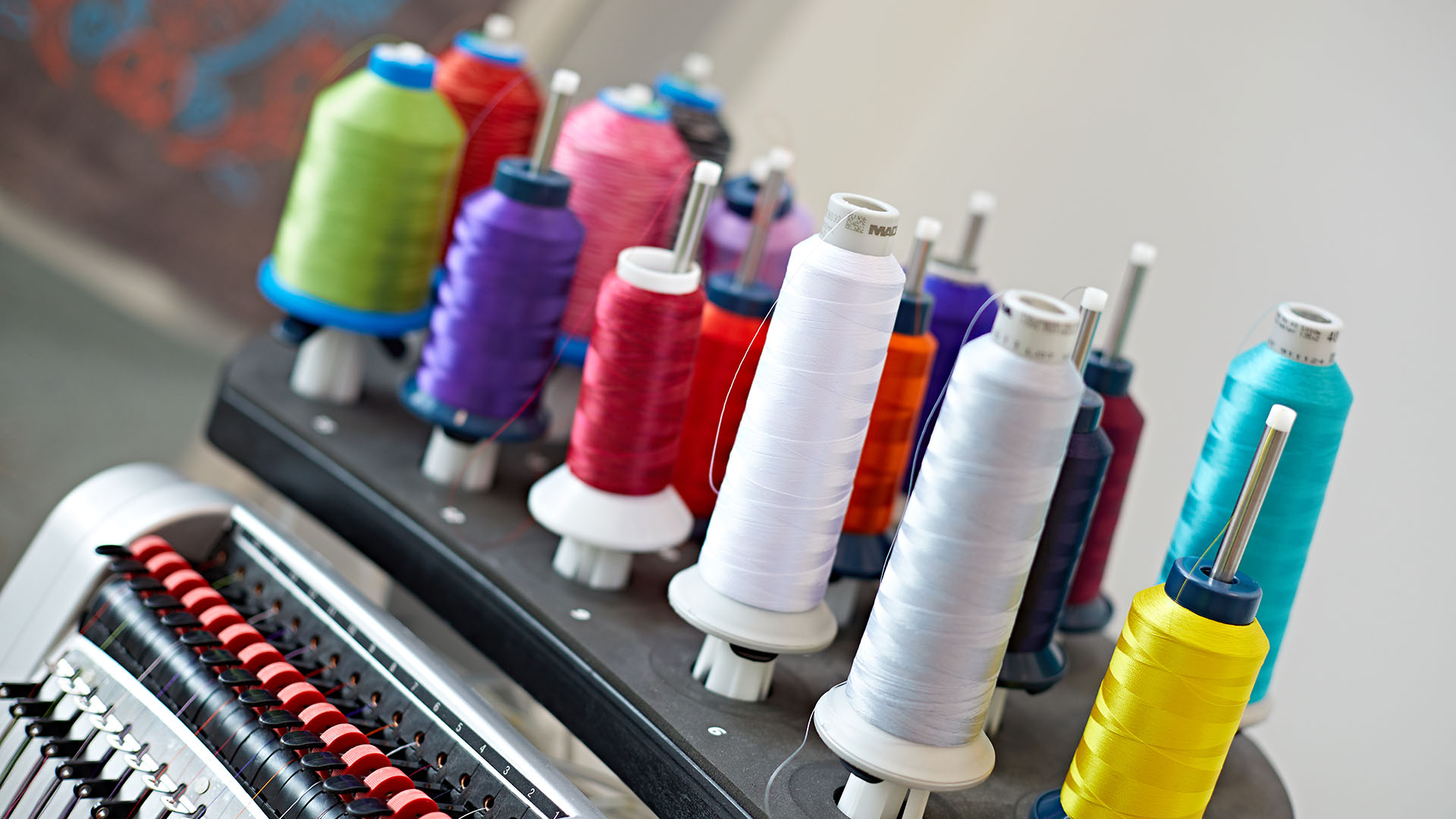 Several large coloured reels of cotton