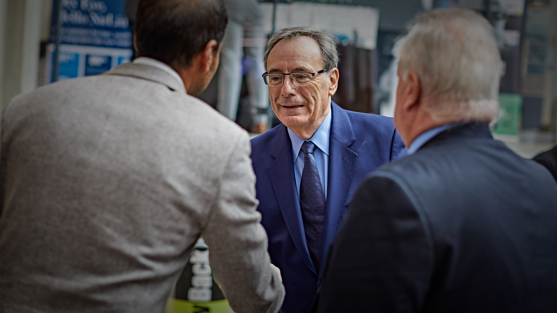 Chancellor Sir George Buckley meets Moin Valli, Managing Director of Valli Opticians