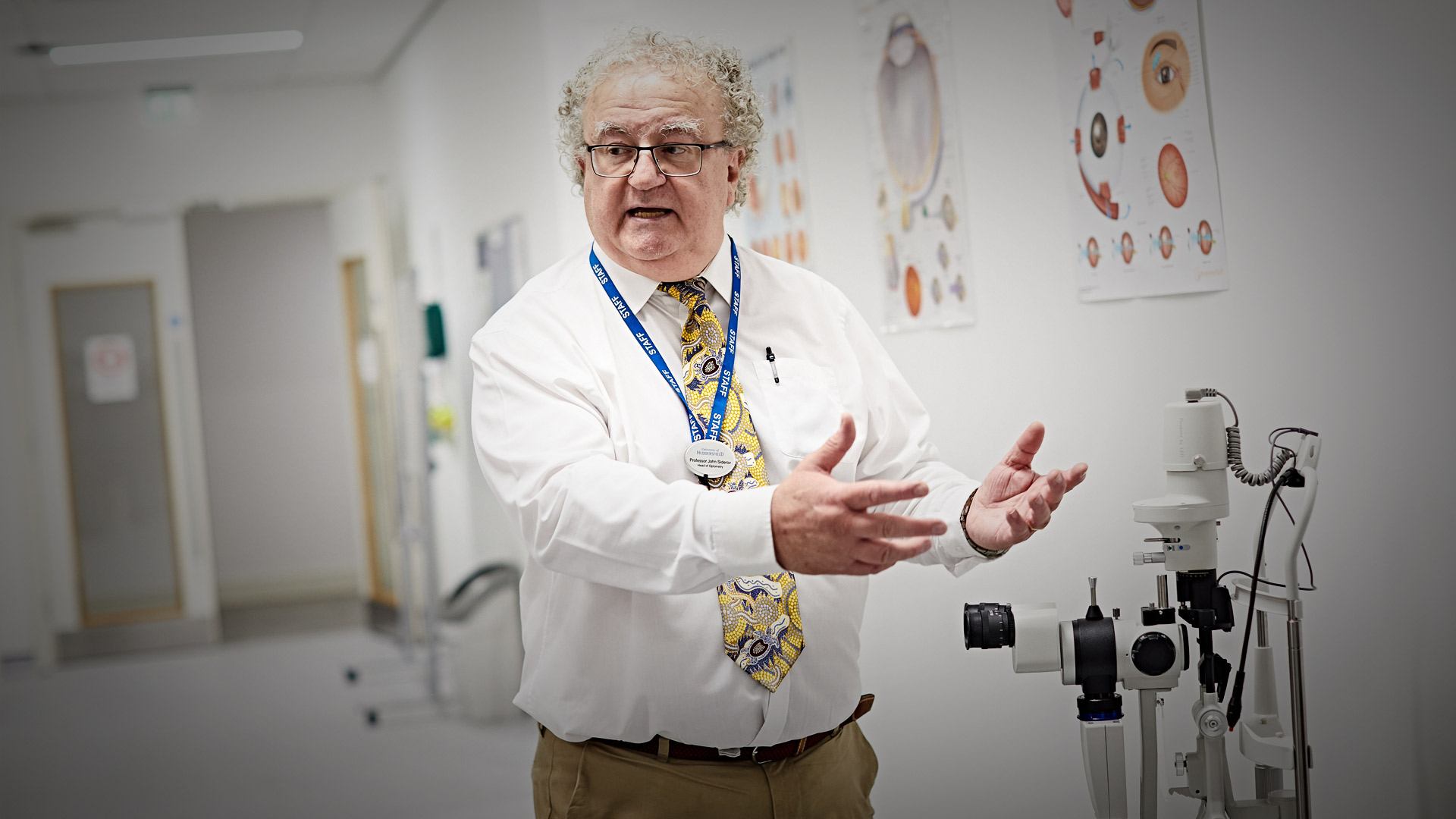 Professor John Siderov, Head of the Department of Optometry and Vision Sciences, shows the Chancellor Sir George Buckley around the new state-of-the-art facilities